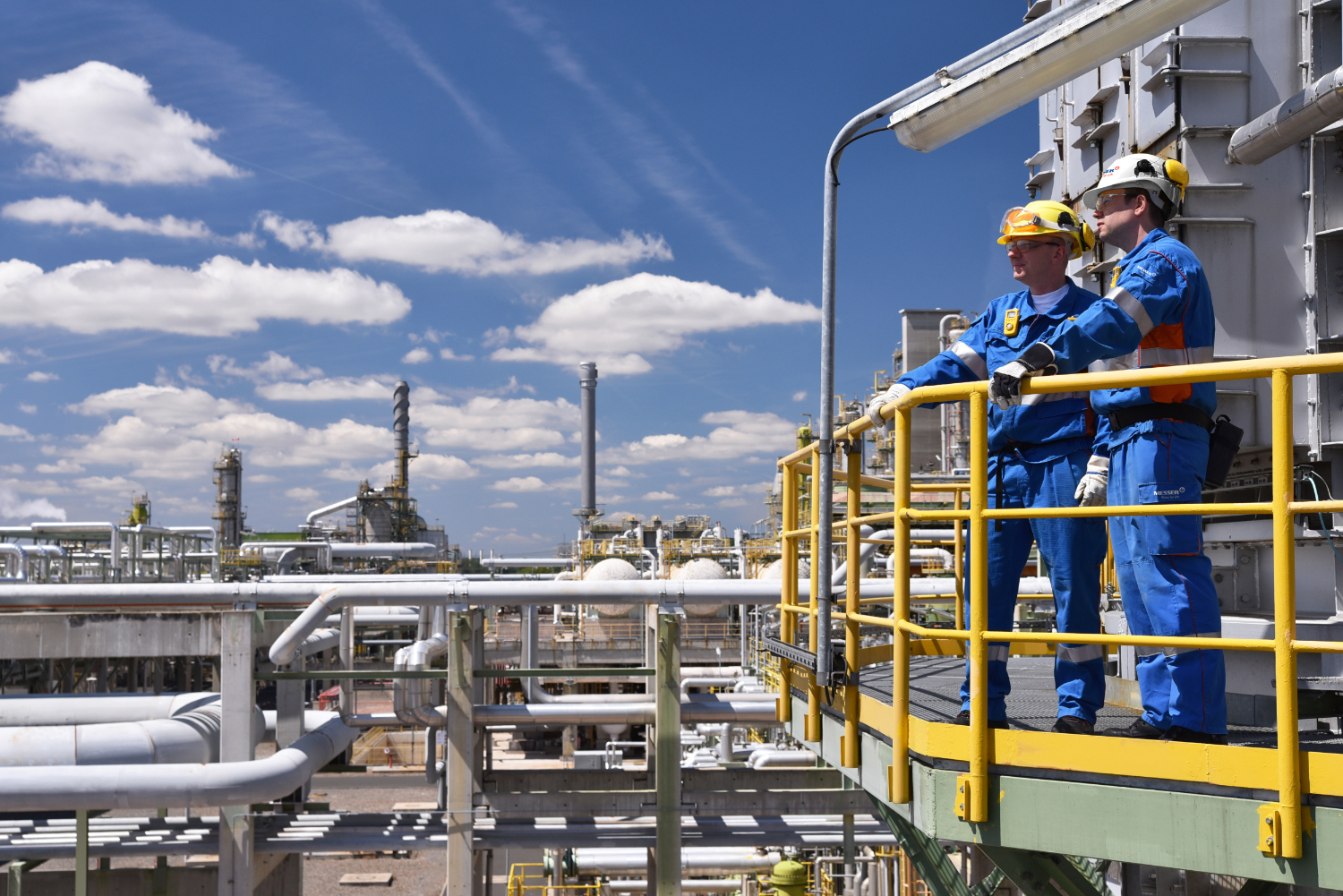 Background Image of 2 men at refinery-1