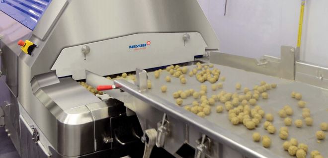 photo of Messer machinery freezing food on a conveyer belt